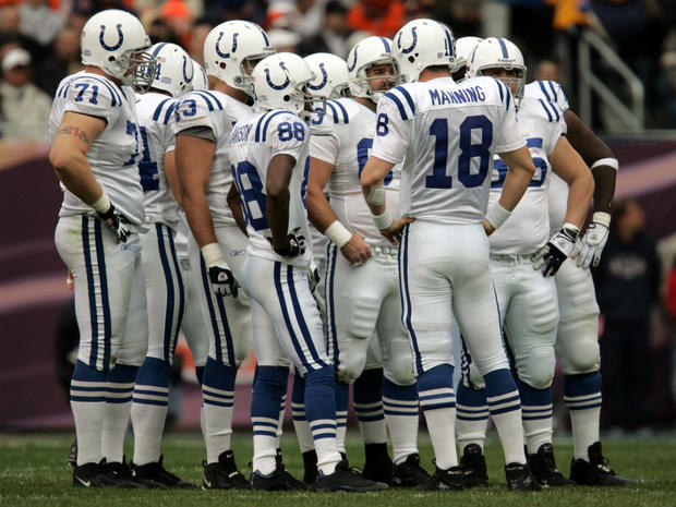 Peyton Manning of the Indianapolis Colts leads a huddle  