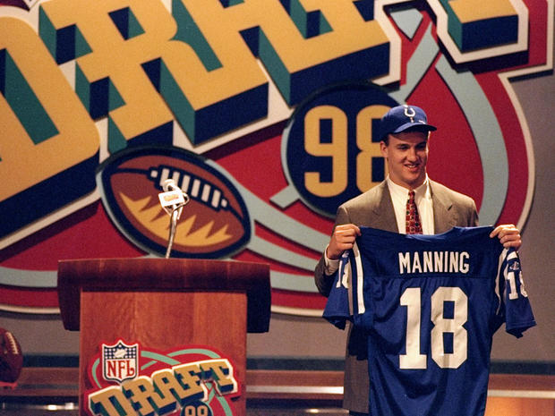 Peyton Manning shows off his jersey after being selected by the Indianapolis Colts in the first round  