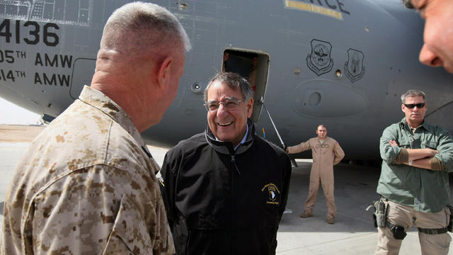 Defense Secretary Leon Panetta is greeted upon his arrival at Camp Bastion 