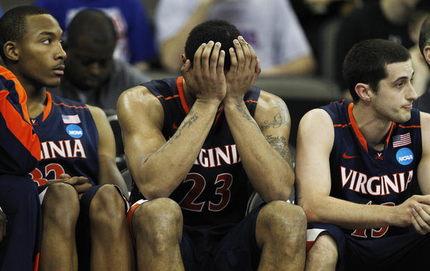 Virginia forward Mike Scott holds head during defeat 