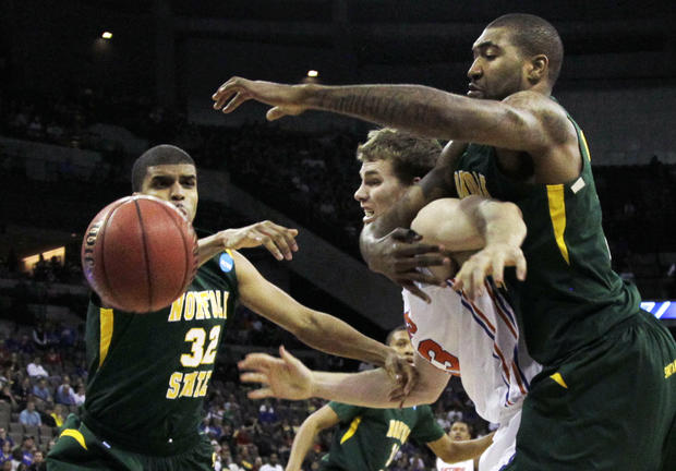 Norfolk State's Marcos Tamares (32) and Kyle O'Quinn, right. battle Florida guard Bradley Beal  