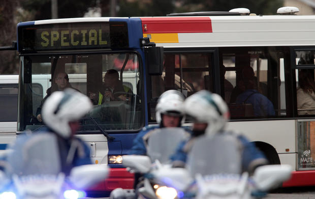Police evacuate people in a bus as they leave their homes next to the building in Toulouse, France, March 21, 2012, where a suspect in the shooting at the Ozar Hatorah Jewish school has been spotted. 