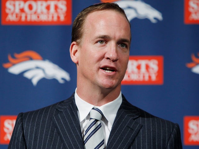 Peyton Manning speaks during a news conference 