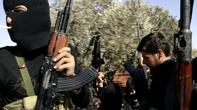 Syrian rebels patrol and set up check-points in northern Syria's Idlib region March 18, 2012. 