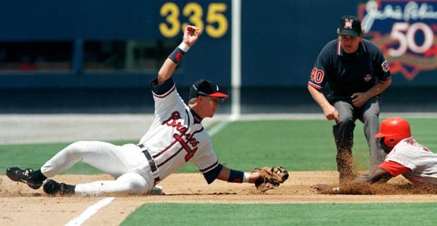 Pokey Reese is tagged out by Chipper Jones 