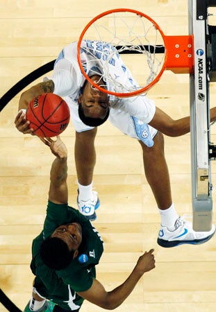  T.J. Hall  rejects a shot by North Carolina forward John Henson  