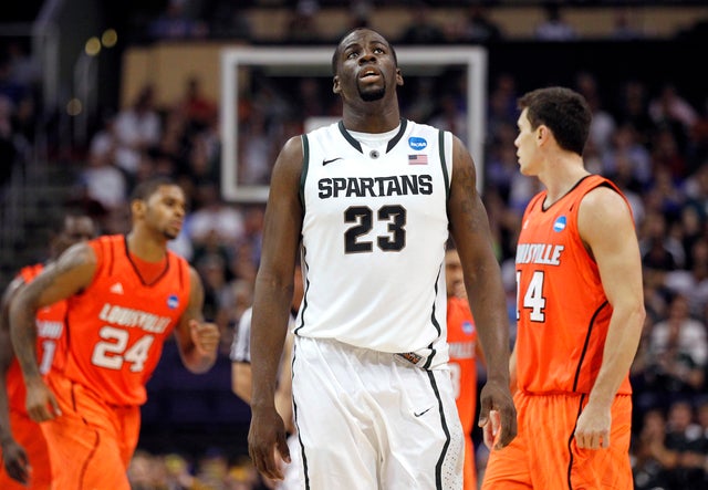 Draymond Green walks off the court  