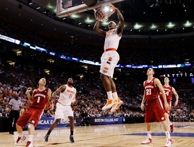 C.J. Fair dunks in front of Ben Brust and Josh Gasser 