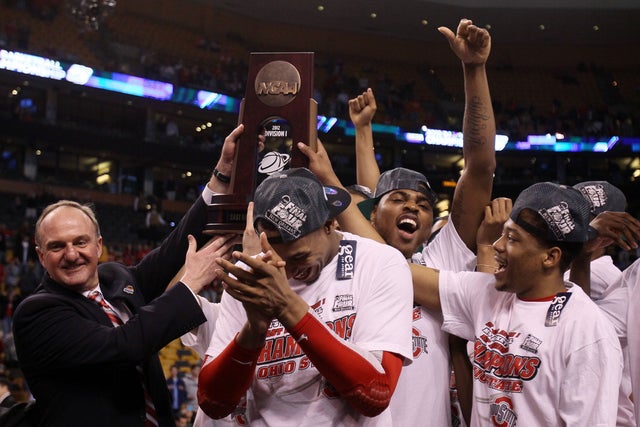 Thad Matta and the Ohio State Buckeyes celebrate after defeating the Syracuse Orange 