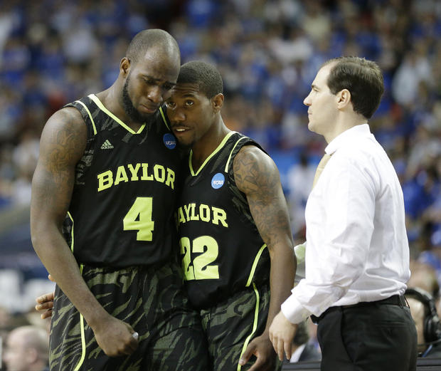 Baylor's Quincy Acy (4) and Baylor's A.J. Walton (22) walk by Baylor head coach Scott Drew in the closing seconds 