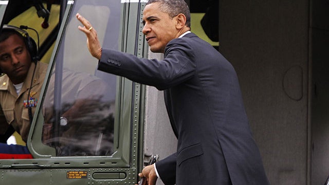 President Barack Obama waves as he boards Marine One helicopter on the South Lawn of the White House in Washington, March 30, 2012, as he travels to Vermont and Maine.  