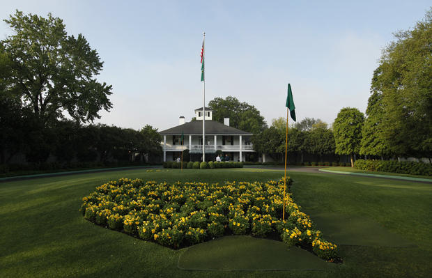 The sun rises over the Augusta National Golf Club house 