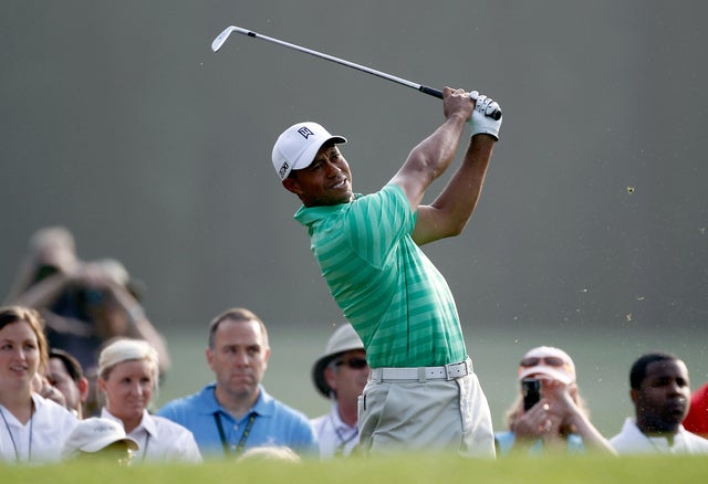 Tiger Woods hits a tee shot 