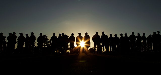 Spectators line the 18th fairway  