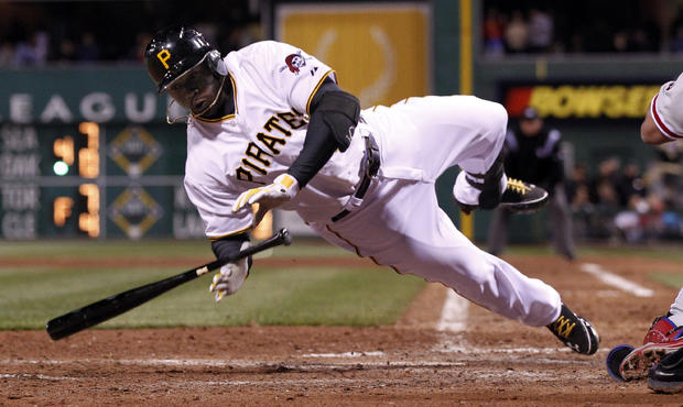 Josh Harrison twirls to the ground after being hit by a pitch 
