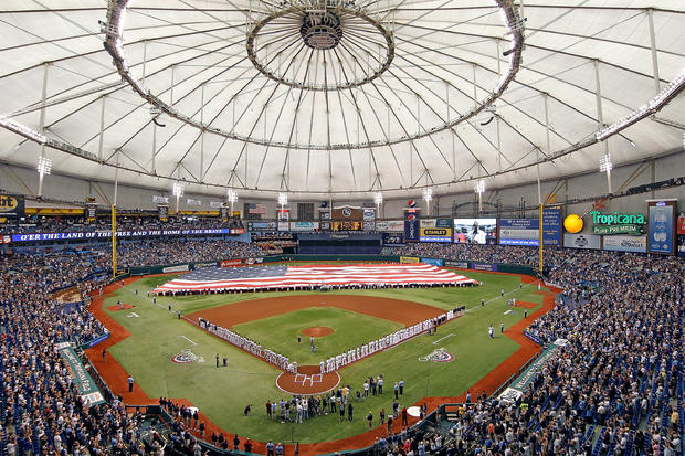 The Tampa Bay Rays and the New York Yankees line up for the National Anthem 