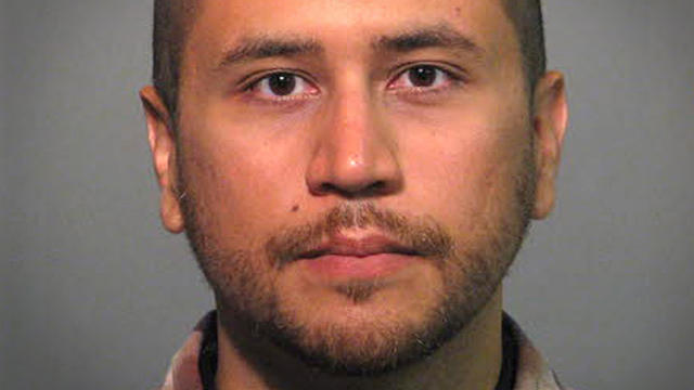 George Zimmerman poses for a booking photo 
