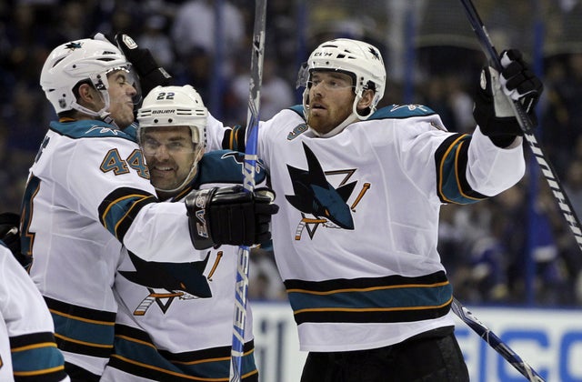 Martin Havlat is congratulated by teammates Marc-Edouard Vlasic and Dan Boyle 
