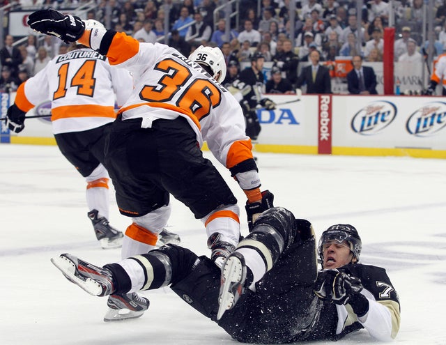 Zac Rinaldo checks Evgeni Malkin 