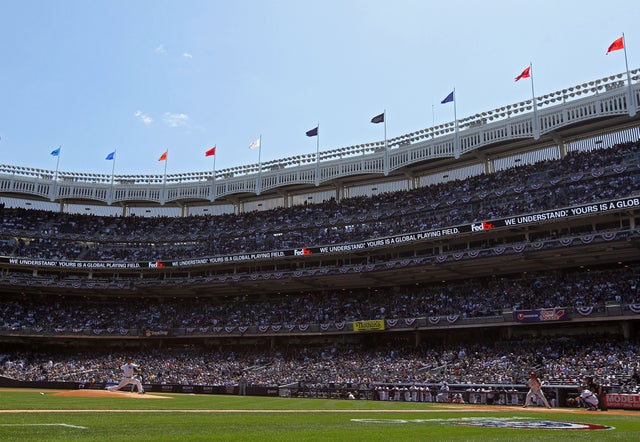 Hiroki Kuroda throws the first pitch of the game 