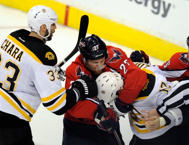 Karl Alzner  mixes it up with Milan Lucic 