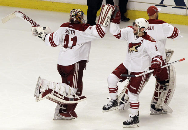 Mike Smith celebrates with Keith Yandle  