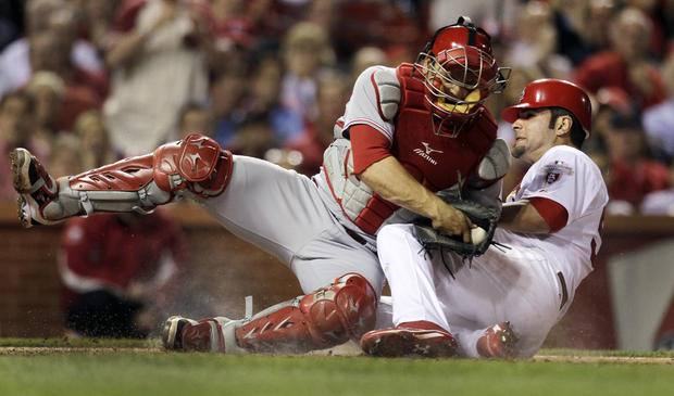 Devin Mesoraco holds on to the ball  
