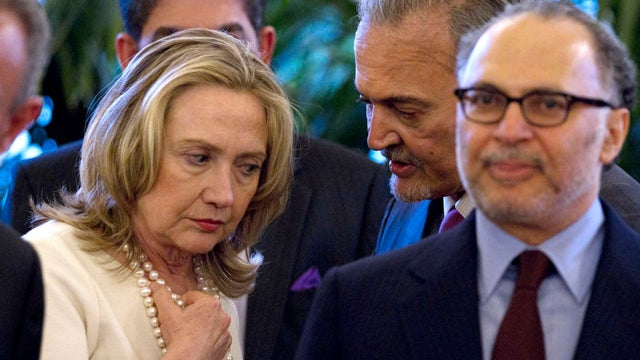 U.N.-Arab League Joint Special Envoy for Syria Kofi Annan, left, and Syrian President Bashar Assad attend a meeting in Damascus, Syria, May 29, 2012, in this picture released by the Syrian official news agency SANA. 