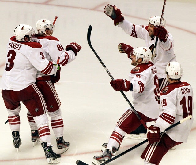 Mikkel Boedker celebrates with teammates after scoring his game-winning goal 