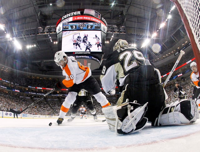 Jaromir Jagr handles the puck in front of Marc-Andre Fleury  