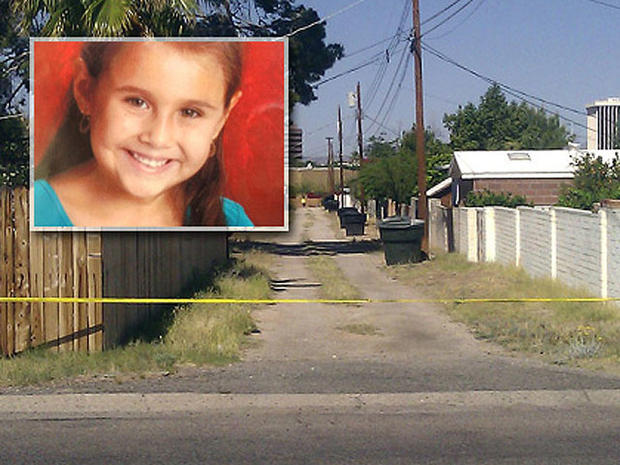 An alley path behind the street where 6-year-old Tucson girl Isabel Mercedes Celis went missing from her home is cut off with police tape in Tucson, Ariz., April 22, 2012. 