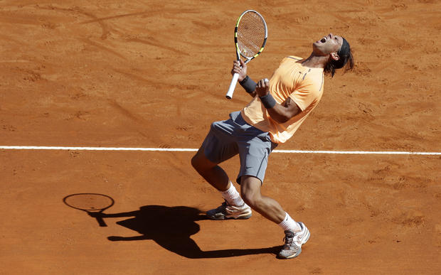 Rafael Nadal reacts after defeating Novak Djokovic 