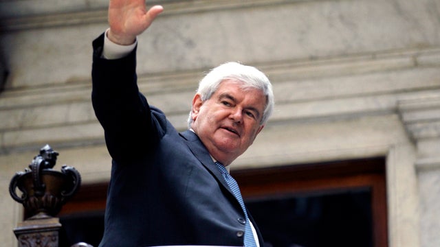 Former House Speaker Newt Gingrich waves to supporters as he leaves a campaign stop in Buffalo, N.Y., April 20, 2012. 