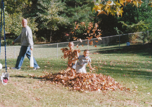 Garret and Gavin Coleman playing in the leaves 