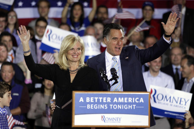 Mitt Romney, right, and wife Ann wave at an election night rally  