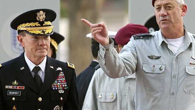 In this Jan. 20, 2012 file photo, Israel 's Chief of Staff Lt. Gen. Benny Gantz, right, and U.S. military chief Martin Dempsey arrive at a ceremony at the Rabin military base in the Mediterranean city of Tel Aviv.  