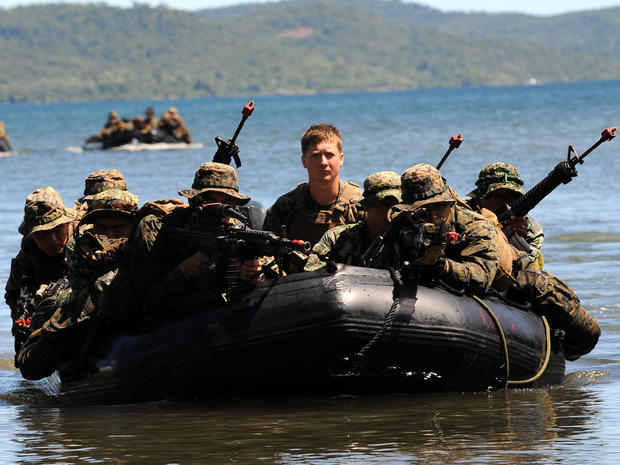 U.S. and Filipino soldiers are seen on a boat during a joint mock beachfront assault on the shore of Ulugan Bay on Palawan island in the Philippines April 25, 2012. 