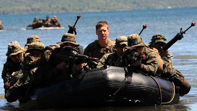U.S. and Filipino soldiers are seen on a boat during a joint mock beachfront assault on the shore of Ulugan Bay on Palawan island in the Philippines April 25, 2012. 