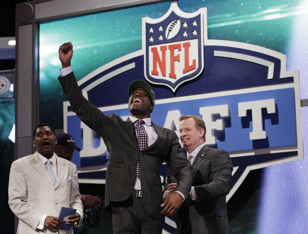 Georgia Tech wide receiver Stephen Hill celebrates as NFL Commissioner Roger Goodell 