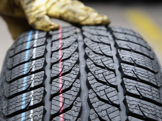 BERLIN - OCTOBER 07: The profile of a snow tire is pictured at a tire dealer on October 7, 2010 in Berlin, Germany. German drivers will be forced to make sure they have proper tyres for driving in mud and snow this winter after Transport Minister Peter Ramsauer announced a safety crackdown on Wednesday. (Photo by Andreas Rentz/Getty Images) 