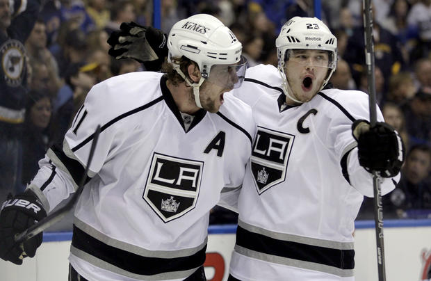 Anze Kopitar is congratulated by Dustin Brown after scoring 