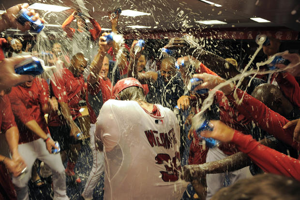 Jered Weaver is doused with beer by teammates  