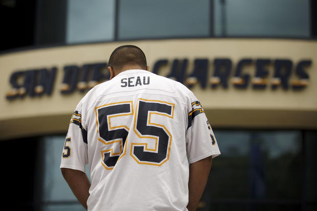 San Diego Chargers football fan Paul Camacho wears the uniform of Junior Seau 