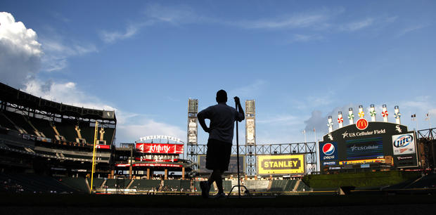 Roger Bossard, Chicago White Sox head groundskeeper at U.S. Cellular Field, waits for batting practice to end  