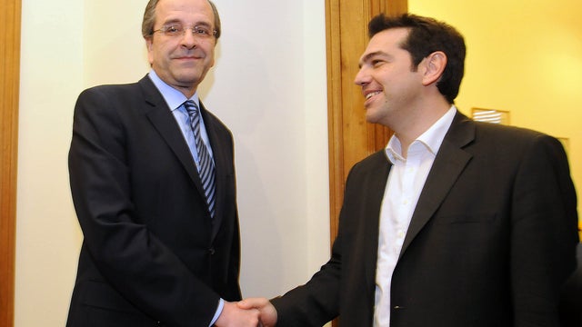 Greek leader of Coalition of the Radical Left party, Alexis Tsipras, right, and leader of the Conservative Party Antonis Samaras at the Greek Parliament in Athens, May 9, 2012.  