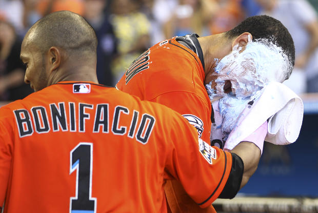 Emilio Bonifacio hits Giancario Stanton in the face with a shaving cream pie 