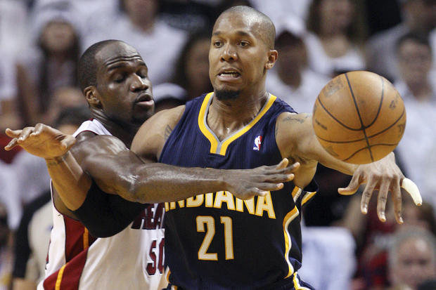 David West passes as he is guarded by Joel Anthony  