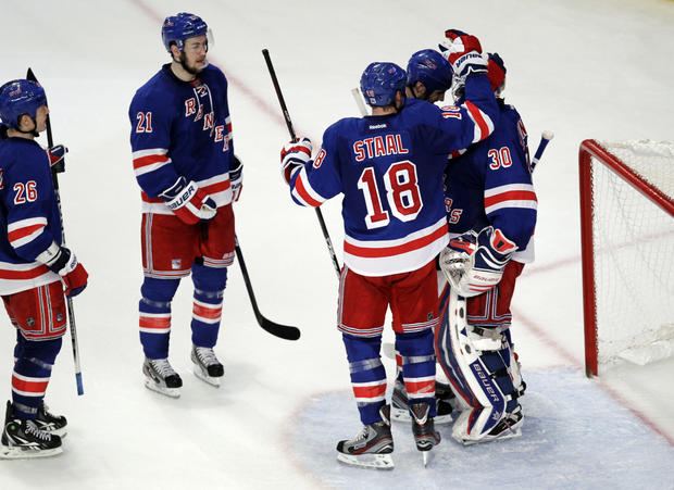 New York Rangers players react after defeating the New Jersey Devils 