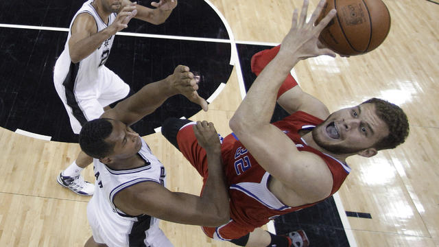 Blake Griffin works against Tim Duncan 