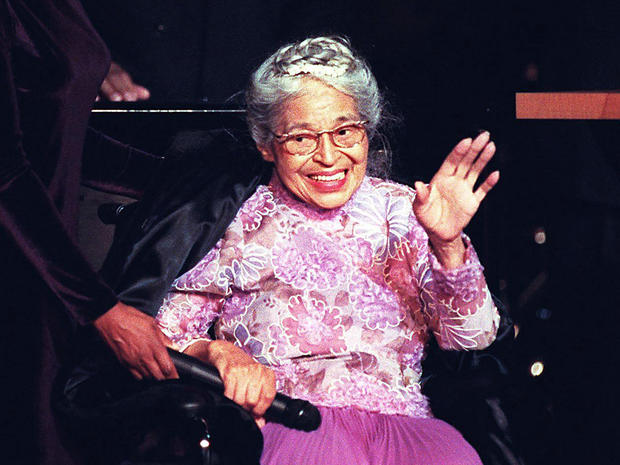 Civil rights icon Rosa Parks waves to the audience 